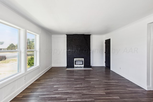 818 N Someville St, Pampa, TX 79065 - unfurnished living room with baseboards, ornamental molding, heating unit, and dark wood-style flooring