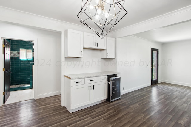 818 N Someville St, Pampa, TX 79065 - kitchen with white cabinets, baseboards, dark wood-type flooring, wine cooler, and ornamental molding