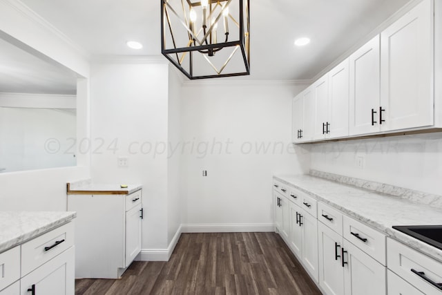 818 N Someville St, Pampa, TX 79065 - kitchen featuring crown molding, a notable chandelier, dark wood finished floors, and white cabinets