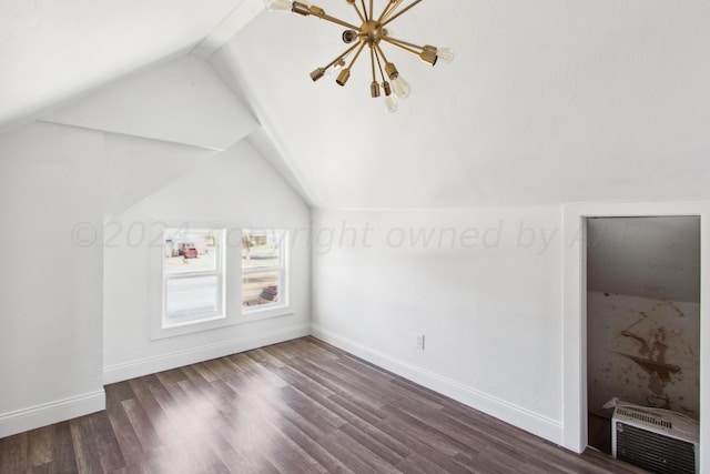 818 N Someville St, Pampa, TX 79065 - bonus room with baseboards, vaulted ceiling, and dark wood-style floors
