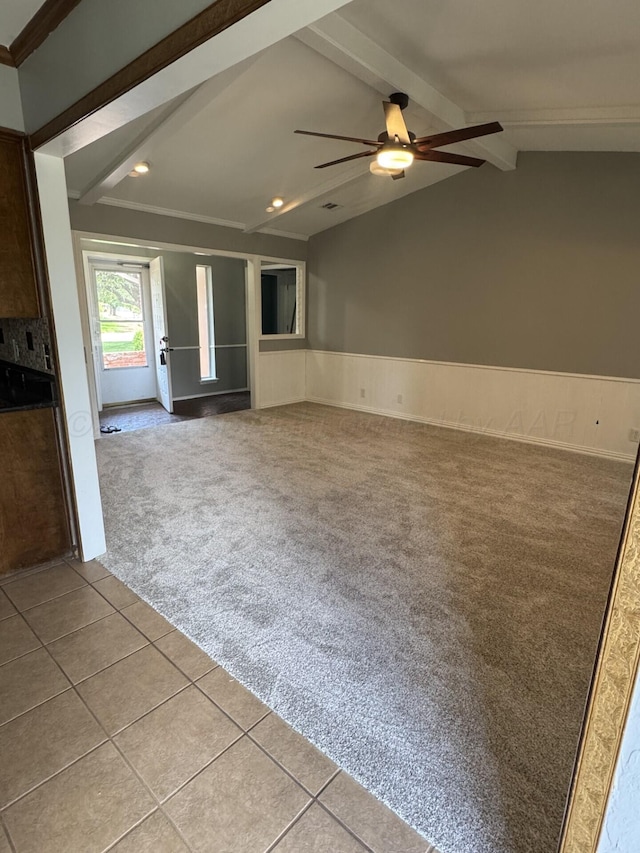 7935 Mitcham Dr, Amarillo, TX 79121 - unfurnished living room featuring carpet, a ceiling fan, wainscoting, recessed lighting, and tile patterned flooring
