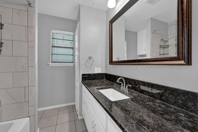 7935 Mitcham Dr, Amarillo, TX 79121 - full bathroom featuring vanity, tile patterned flooring, shower / bathtub combination, and baseboards