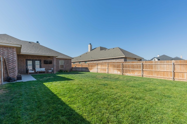 view of yard featuring a patio and a fenced backyard