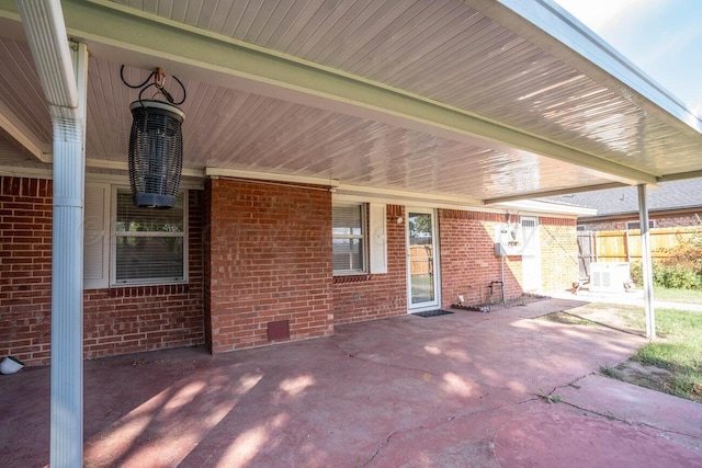 view of patio / terrace featuring fence