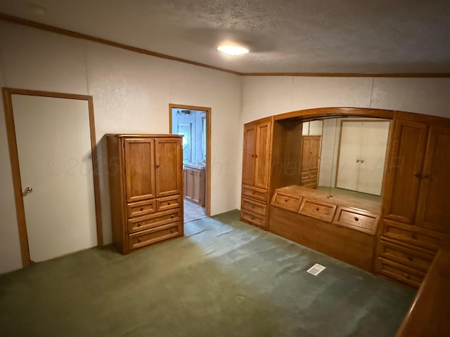 1046 S Farley St, Pampa, TX 79065 - unfurnished bedroom featuring arched walkways, ornamental molding, carpet, and a textured ceiling