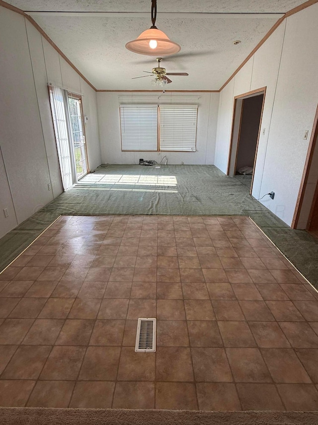 1046 S Farley St, Pampa, TX 79065 - hall featuring ornamental molding, vaulted ceiling, and a textured ceiling