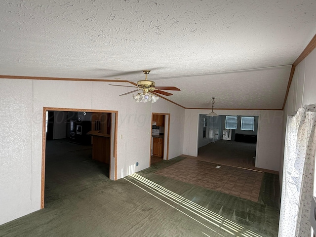 1046 S Farley St, Pampa, TX 79065 - unfurnished living room featuring ceiling fan, lofted ceiling, a textured ceiling, carpet flooring, and ornamental molding