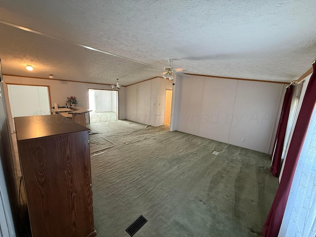 1046 S Farley St, Pampa, TX 79065 - unfurnished room featuring carpet floors, a textured ceiling, vaulted ceiling, and ceiling fan