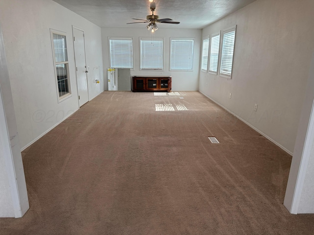 1046 S Farley St, Pampa, TX 79065 - unfurnished living room with carpet and a ceiling fan