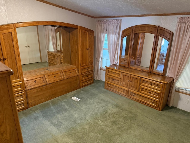 1046 S Farley St, Pampa, TX 79065 - unfurnished bedroom with arched walkways, carpet, a textured ceiling, ornamental molding, and multiple windows
