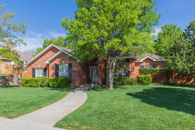 6504 Bayberry Ln, Amarillo, TX 79124 - view of front facade featuring a front lawn and brick siding