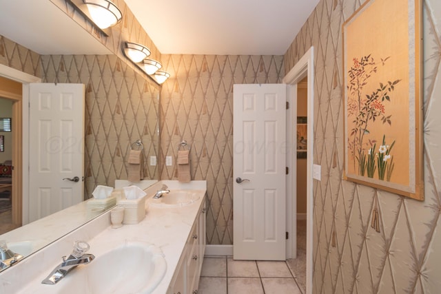 6504 Bayberry Ln, Amarillo, TX 79124 - bathroom with wallpapered walls, double vanity, tile patterned flooring, and baseboards