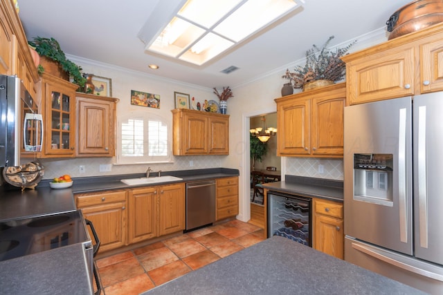 6504 Bayberry Ln, Amarillo, TX 79124 - kitchen featuring appliances with stainless steel finishes, a sink, beverage cooler, dark countertops, and ornamental molding
