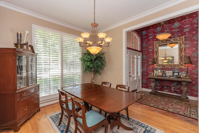 6504 Bayberry Ln, Amarillo, TX 79124 - dining area featuring a chandelier, plenty of natural light, light wood-style flooring, and ornamental molding