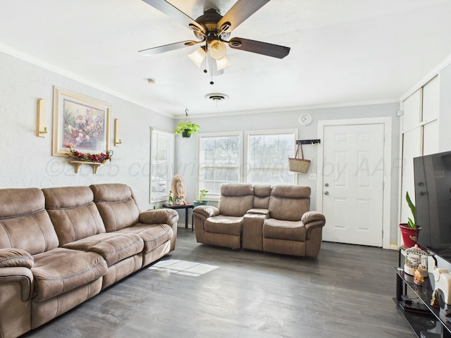 living area with dark wood-style floors, visible vents, crown molding, and ceiling fan