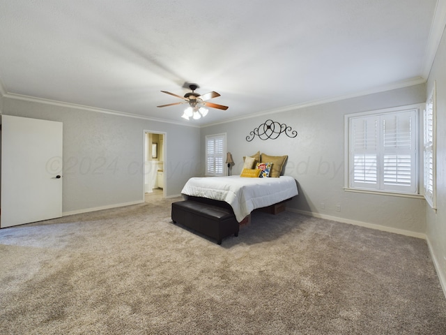 bedroom featuring carpet, ensuite bathroom, ceiling fan, and ornamental molding