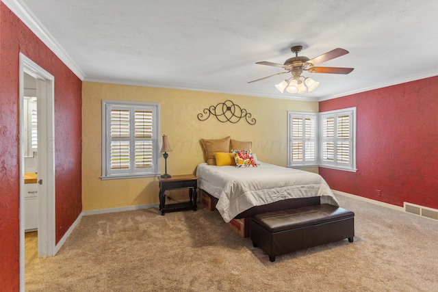 bedroom featuring a textured ceiling, ceiling fan, carpet floors, and ornamental molding