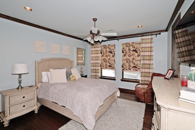 bedroom with ornamental molding, ceiling fan, and dark hardwood / wood-style floors