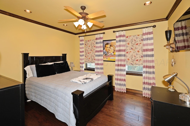 bedroom featuring ornamental molding, multiple windows, dark hardwood / wood-style flooring, and ceiling fan