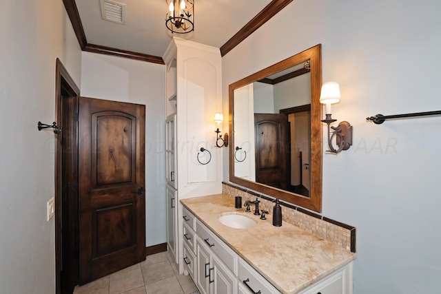 bathroom featuring vanity, tile patterned flooring, and crown molding