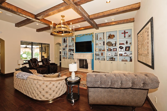 living room featuring hardwood / wood-style floors, beamed ceiling, a chandelier, and coffered ceiling