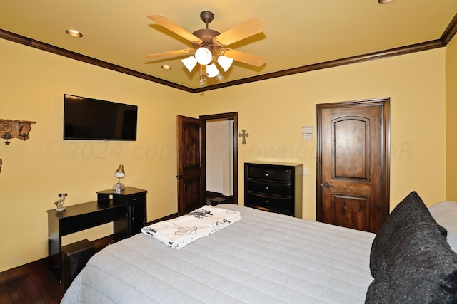 bedroom featuring dark wood-type flooring, ceiling fan, and ornamental molding