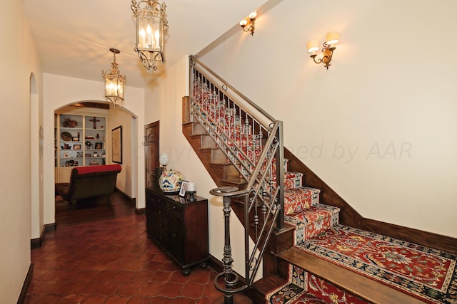 stairs with tile patterned floors