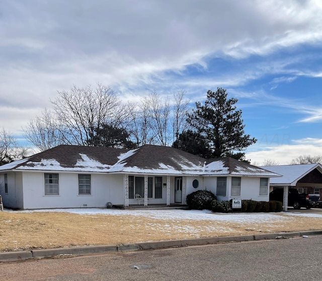 ranch-style house featuring a carport