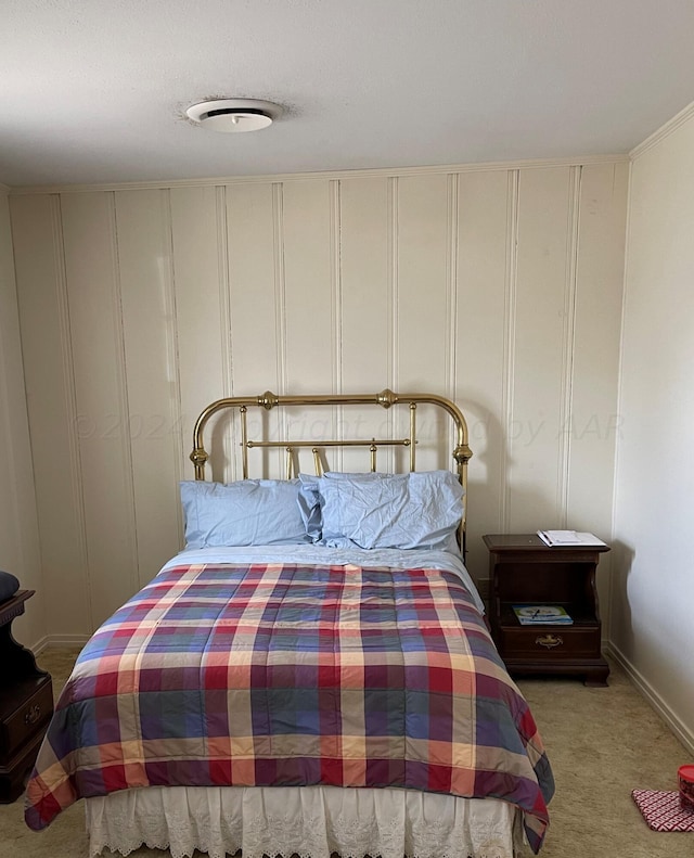 bedroom with light carpet and a closet