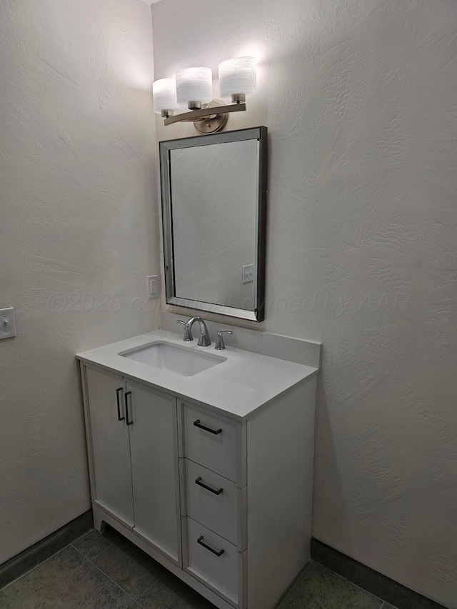 bathroom featuring vanity and baseboards