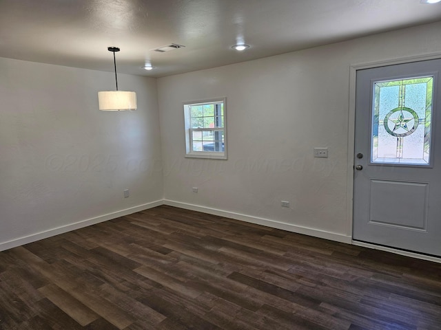 entrance foyer with dark wood-style flooring, baseboards, and visible vents