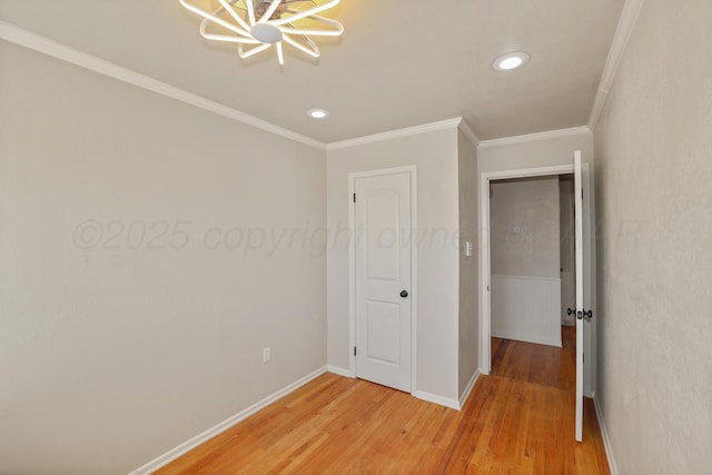 unfurnished bedroom with hardwood / wood-style flooring and ornamental molding