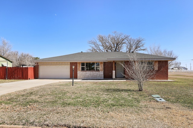 ranch-style home with a garage and a front yard