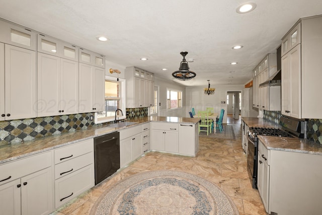 kitchen featuring pendant lighting, white cabinets, sink, and black appliances