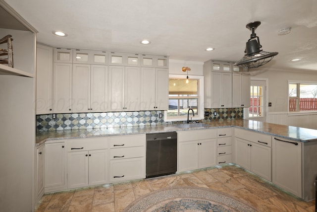 kitchen featuring white cabinetry, decorative light fixtures, dishwasher, and sink