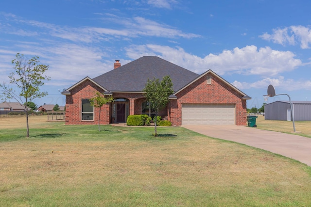 single story home featuring a garage and a front yard