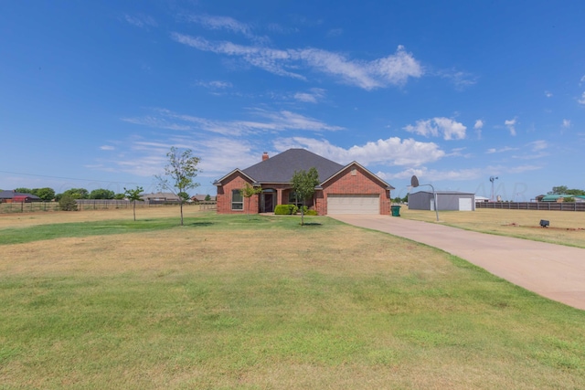 ranch-style house featuring a garage and a front lawn