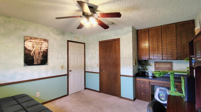 406 Bradley Ln, Dumas, TX 79029 - carpeted office space featuring ceiling fan and a textured ceiling