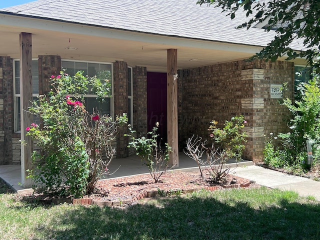 4207 Ross St, Amarillo, TX 79118 - property entrance with roof with shingles and brick siding