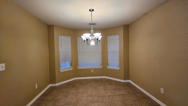 4207 Ross St, Amarillo, TX 79118 - empty room featuring a chandelier and dark tile patterned flooring