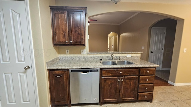 4207 Ross St, Amarillo, TX 79118 - kitchen with stainless steel dishwasher, crown molding, a peninsula, dark brown cabinets, and light tile patterned floors