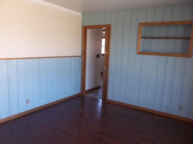 empty room with wood finished floors