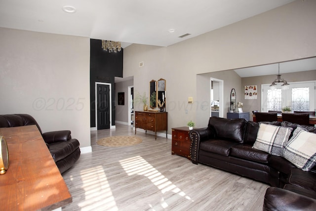 3506 Stromberg Pl, Amarillo, TX 79121 - living area featuring a chandelier, high vaulted ceiling, and light wood finished floors