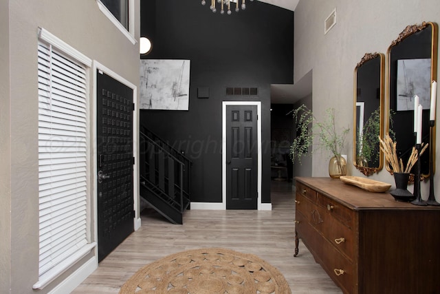 3506 Stromberg Pl, Amarillo, TX 79121 - foyer with a towering ceiling, light wood-style flooring, and stairway