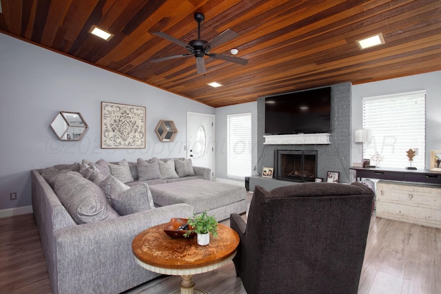 3506 Stromberg Pl, Amarillo, TX 79121 - living room with lofted ceiling, a ceiling fan, wooden ceiling, plenty of natural light, and a large fireplace