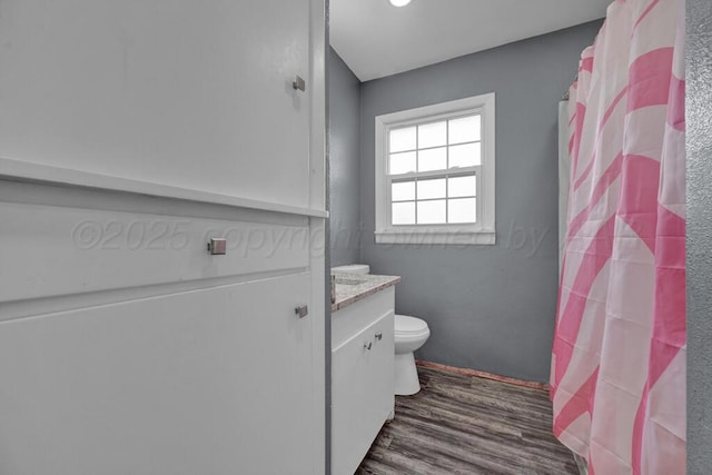 3701 Westlawn Ave, Amarillo, TX 79102 - full bathroom featuring wood finished floors, vanity, and a shower with curtain