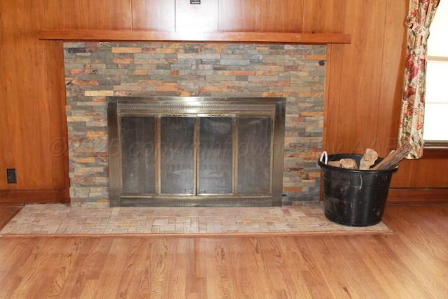 interior details with a fireplace and wood finished floors