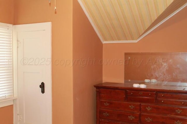 unfurnished bedroom featuring lofted ceiling