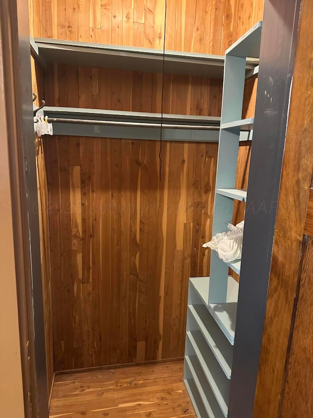 spacious closet with wood finished floors