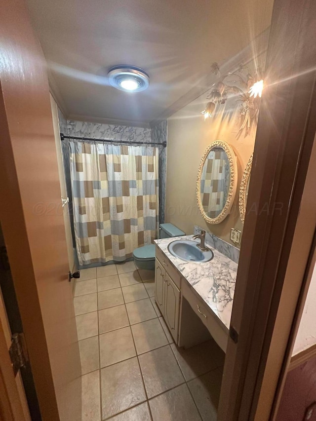 full bathroom with curtained shower, toilet, vanity, and tile patterned flooring